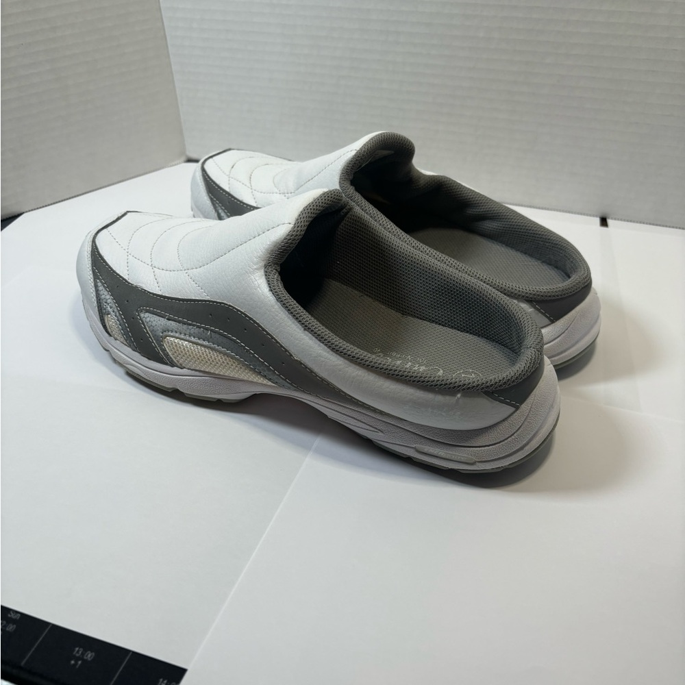 White heelless size 10 shoes.